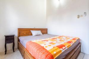 Postel nebo postele na pokoji v ubytování Surya Villa Manggis