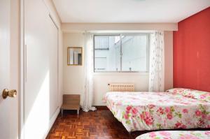 En eller flere senge i et værelse på Apartamento en el centro de Ourense