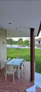 a white table and chairs on a patio at FG Home Rental in Xanthi