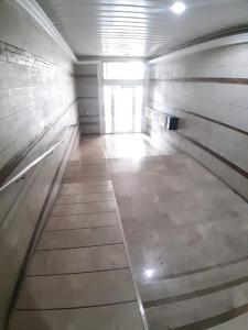 an empty hallway of a building with a long corridor at APARTAMENTO PATRICIA in Murcia