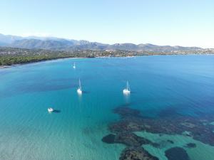an aerial view of boats in a large body of water at Les Regalia Hôtel & Spa in Sainte-Lucie de Porto-Vecchio