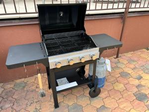 a grill with a laptop sitting on top of it at Villa Casablanca in Braşov