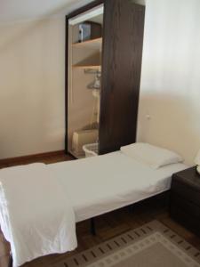 a bed in a room with a mirror at 5006 Port Brescou 310 in Cap d'Agde