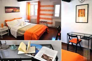 um quarto de hotel com uma cama e uma mesa com livros em Giramondo em Rapallo