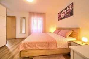 Posteľ alebo postele v izbe v ubytovaní Apartment Mladen