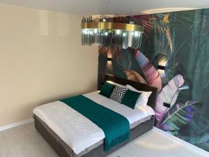 Una cama o camas en una habitación de Terracotta & Rooms комфортная студия для отдыха