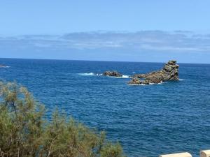 a group of rocks in the middle of the ocean at Cosy twin beds El Galeon in Santa Cruz de Tenerife