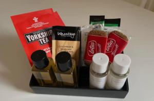 a group of products sitting on top of a table at APlaceToStay Central London Apartment, Waterloo (STA) in London