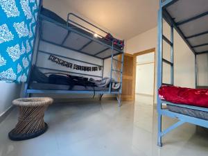 Łóżko lub łóżka w pokoju w obiekcie Bir Nest Hostel