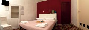 Postel nebo postele na pokoji v ubytování B&B Porto Trani