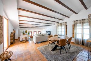 a living room with a table and a couch at Casa Daci in Altea