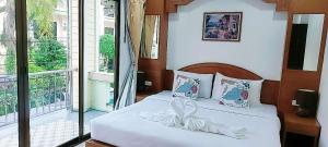 Ένα ή περισσότερα κρεβάτια σε δωμάτιο στο AINNY Residence