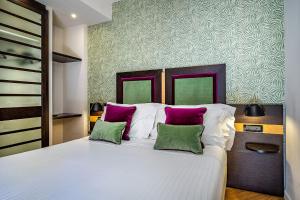 Postel nebo postele na pokoji v ubytování Hotel Duomo Firenze