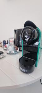 a black helmet sitting on top of a counter at B&B D'AMARE in Cupra Marittima