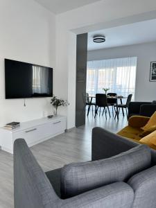TV a/nebo společenská místnost v ubytování Rivapark