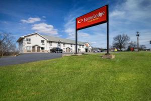 a sign in the grass in front of a building at Econo Lodge Inn & Suites in Canandaigua