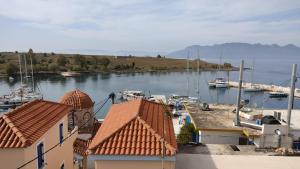 a view of a marina with boats in the water at Margeo house in Perdika