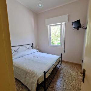 Postel nebo postele na pokoji v ubytování Borgomare Camere e Colazioni