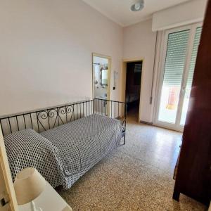 Postel nebo postele na pokoji v ubytování Borgomare Camere e Colazioni
