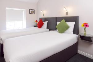 Postel nebo postele na pokoji v ubytování Dan Linehan's B&B