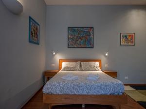 Inappartamento Gioiello tesisinde bir odada yatak veya yataklar
