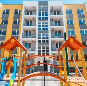 a playground in front of a apartment building at Квартира ЖК 7 Небо Одесса Аквапарк Рынок-7 in Odesa