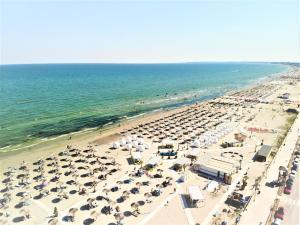 an overhead view of a beach with many umbrellas at Nautic Luxury Club in Mamaia Nord