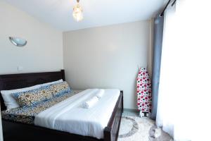 Postel nebo postele na pokoji v ubytování The Bliss - Lovely 1 bedroom apartment located near TRM mall + 28 fotografií