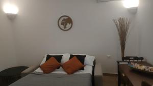 a living room with a couch with pillows on it at Lovin Puglia Vacation in Bari