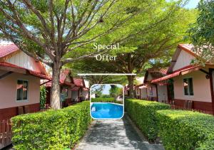 a swimming pool in the courtyard of a villa at Phi Phi Ba Kao Bay Resort in Phi Phi Islands