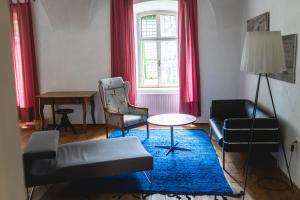 a living room with a couch and a table at Schloss Hornegg in Preding