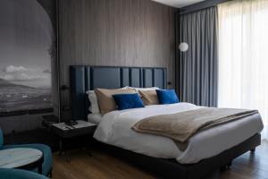 Postel nebo postele na pokoji v ubytování Hotel Leonessa