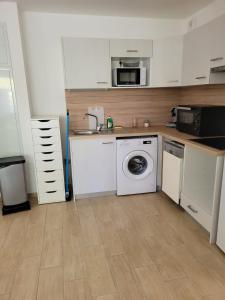 Kuchyňa alebo kuchynka v ubytovaní Superbes appartements neufs à Montpellier
