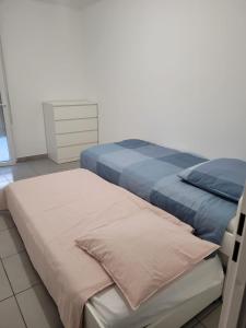 Posteľ alebo postele v izbe v ubytovaní Superbes appartements neufs à Montpellier