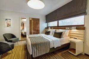 Postel nebo postele na pokoji v ubytování Leonardo Boutique Hotel Krakow City Center