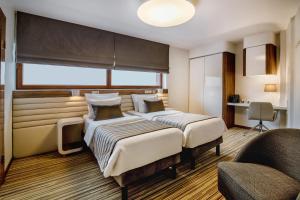 Postel nebo postele na pokoji v ubytování Leonardo Boutique Hotel Krakow City Center