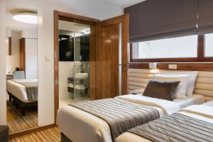 Postel nebo postele na pokoji v ubytování Leonardo Boutique Hotel Krakow City Center