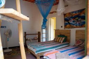 Postel nebo postele na pokoji v ubytování Margarita kitesurfing school Sri Lanka