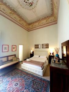 a bedroom with a bed and a coffered ceiling at B&b RARO' LIBERTY in Lecce