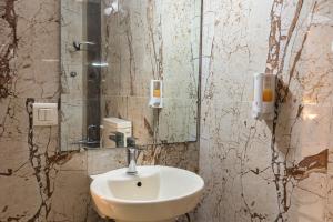 a bathroom with a sink and a mirror at Yorkshire Inn in Mount Ābu +96 photos