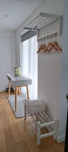 a table and a stool in a room at Lauriston Stay in Birch