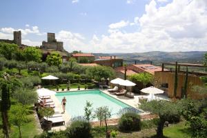 a person standing in a swimming pool in a resort at Casas Do Coro in Marialva