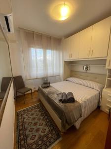 a bedroom with a bed with two shoes on it at Apartment Donatello in Mestre