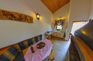 a living room with a table with fruit on it at Holiday home in Donji Prolozac 27078 in Donji Proložac