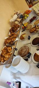 a table topped with lots of different types of food at Hotel Rivamare in Cervia