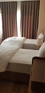 Cama ou camas em um quarto em Sawsana Villalari