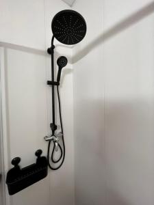 a shower in a bathroom with a shower head at Villa galana in Les Cases d'Alcanar