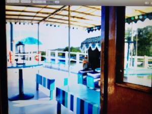 a view of a pool with tables and umbrellas at Schiff AHOY, Hotelschiff, Hausboot, Boot, Passagierschiff in Stuttgart