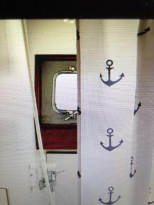 an open door of a train with anchors on it at Schiff AHOY, Hotelschiff, Hausboot, Boot, Passagierschiff in Stuttgart