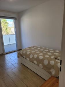 Posteľ alebo postele v izbe v ubytovaní Superbes appartements neufs à Montpellier
